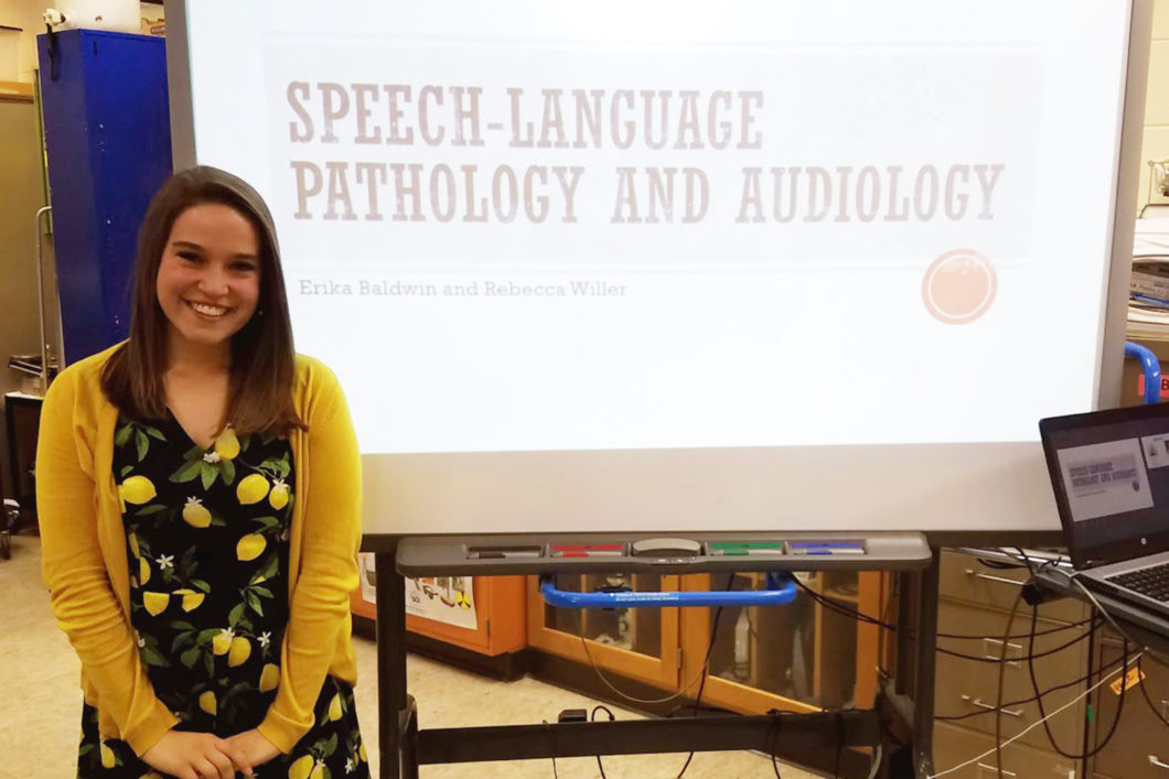 Rebecca Willer presenting to high schooler students about the speech-language pathology and audiology professions.