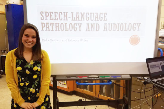 Rebecca Willer presenting to high schooler students about the speech-language pathology and audiology professions.