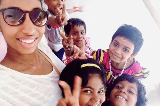 Hamsa Raman with children while visiting India