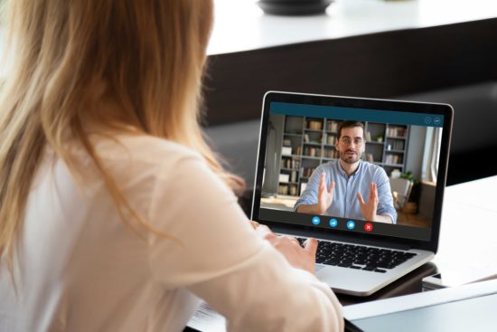 Woman and man holding a video chat conversation