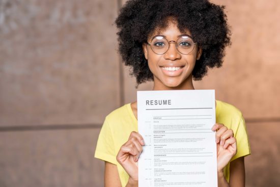 Student holding resume