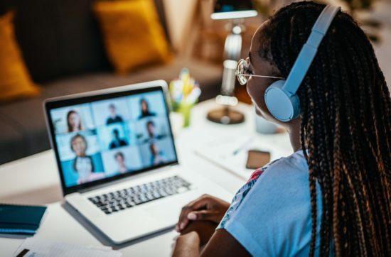 Female student on Zoom call on laptop